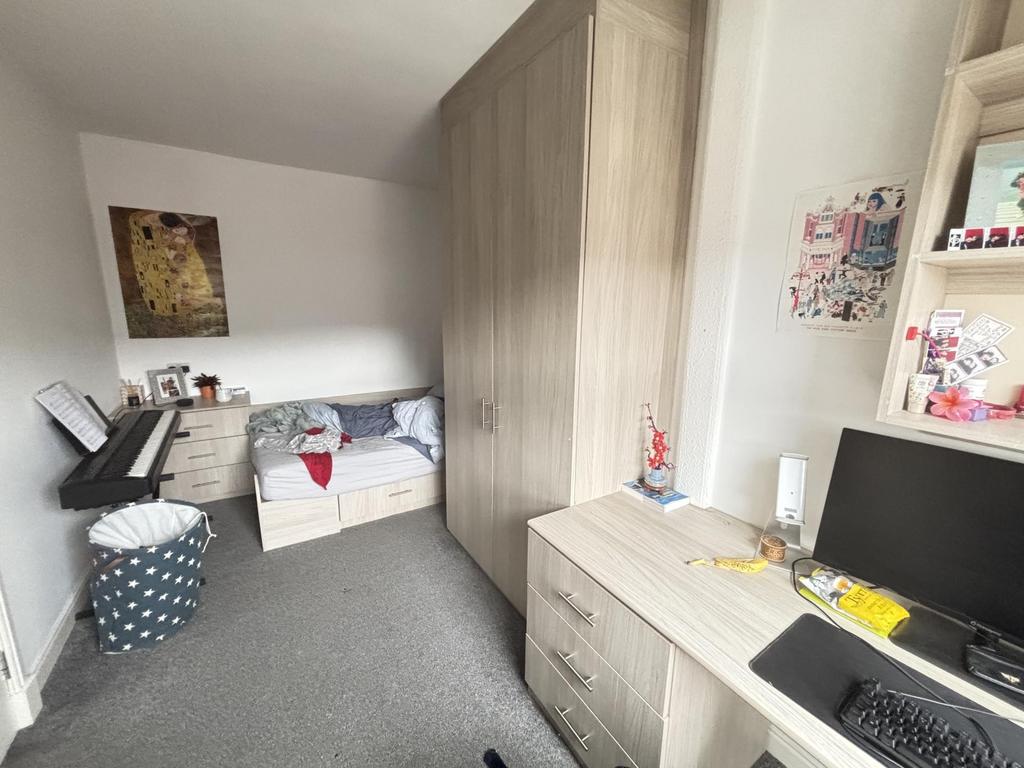 Neat, well-lit bedroom with built-in wardrobe, ...