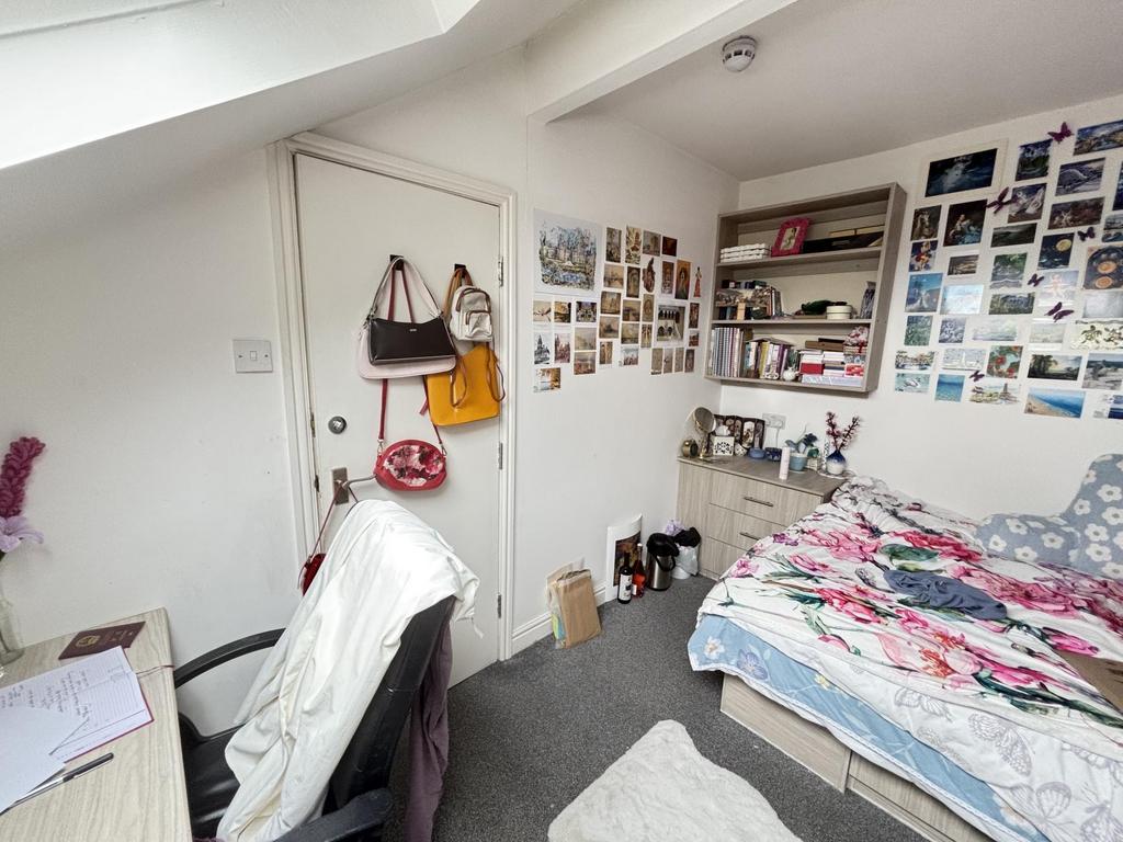 Bright, neatly presented bedroom with a comfort...