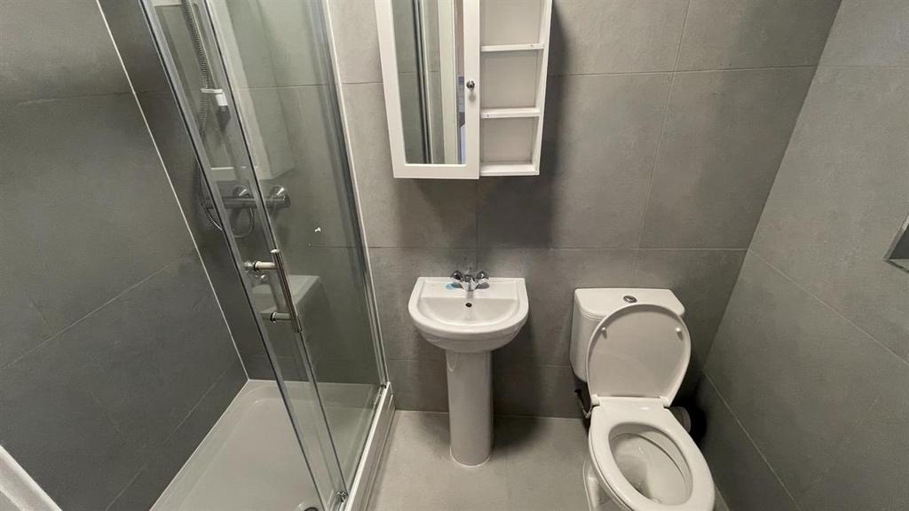 A clean and well-maintained bathroom featuring ...