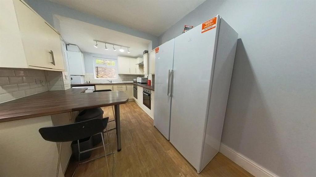 A well-organized kitchen area with ample counte...