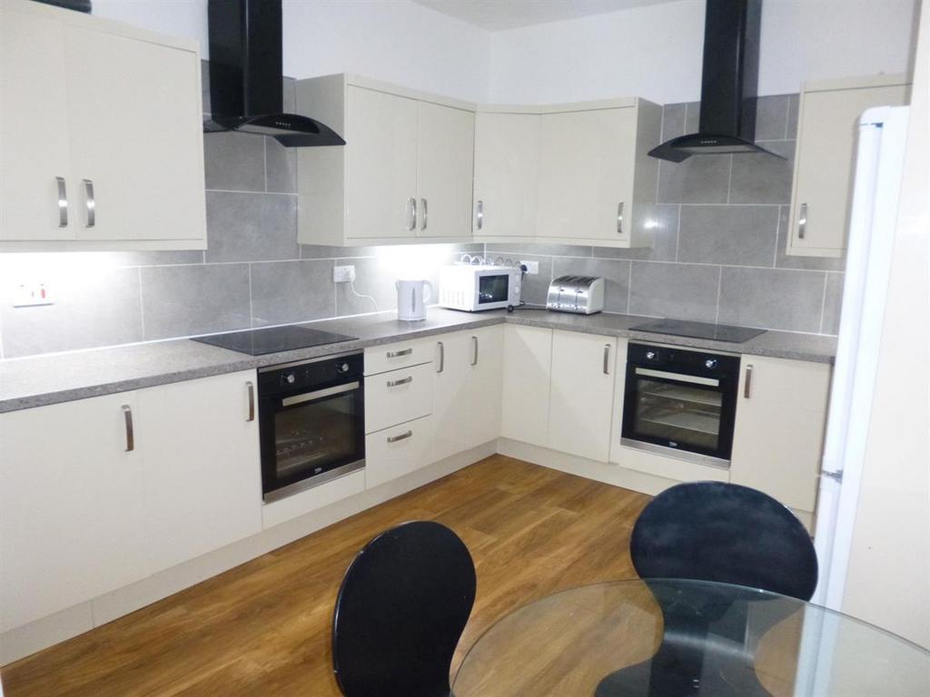 A modern, well-maintained kitchen with ample ca...