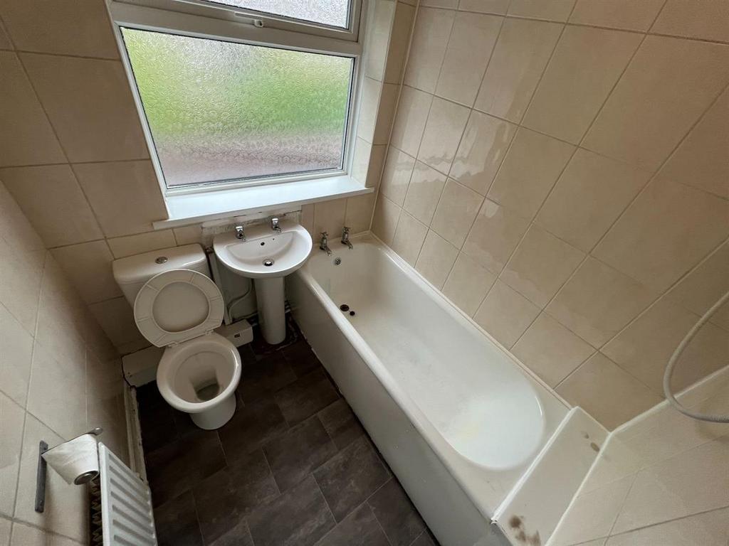 A clean and well-maintained bathroom featuring ...