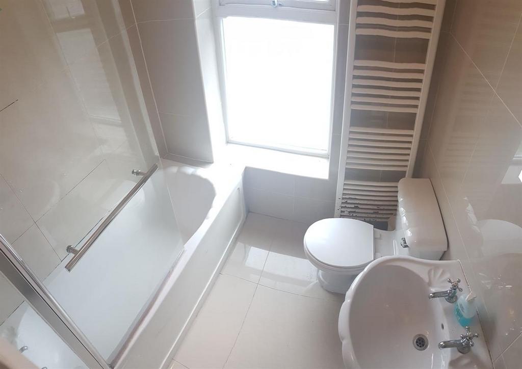 A clean and well-maintained bathroom featuring ...