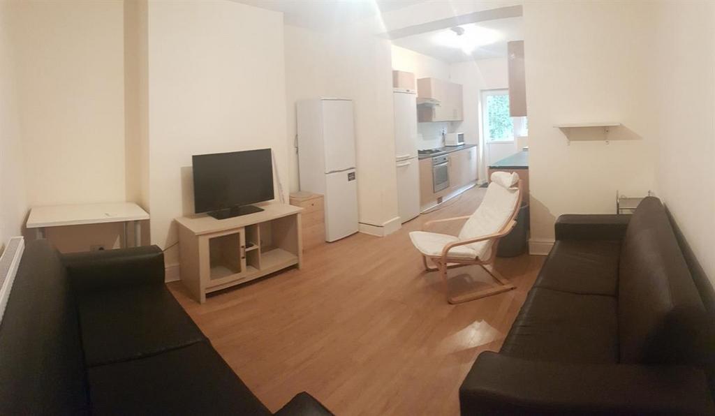 A bright and spacious living room featuring mod...