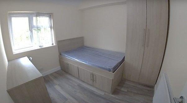A bright and cozy bedroom featuring a single be...