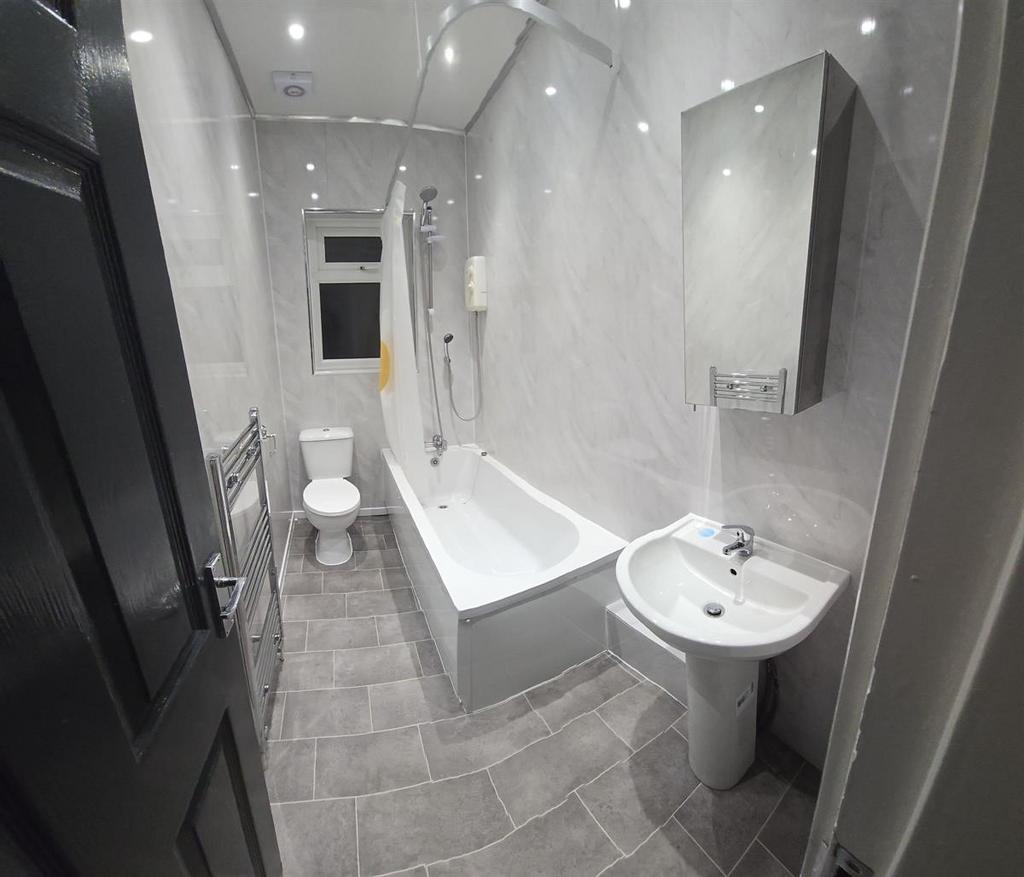 Modern and well-maintained bathroom featuring a...