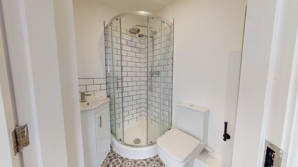 Bright and clean bathroom featuring a spacious ...