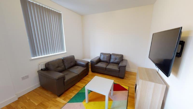 A bright and welcoming living room featuring a ...