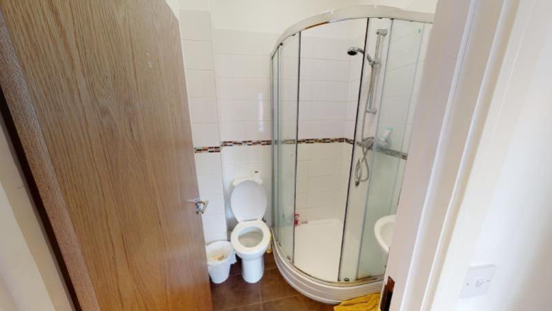 A clean and well-maintained bathroom with a sho...