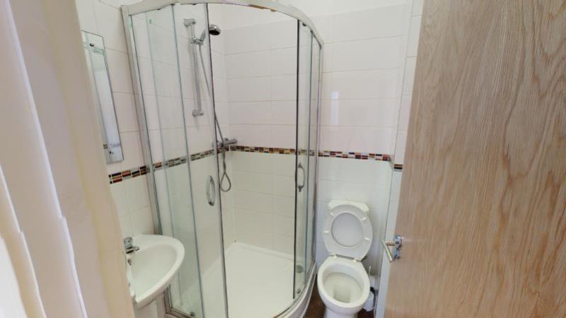 A clean and well-maintained bathroom with a spa...