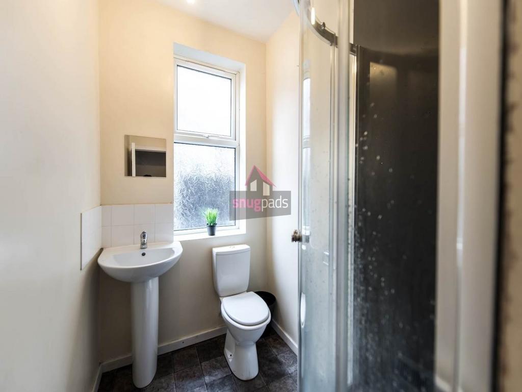A clean and well-maintained bathroom with a sin...