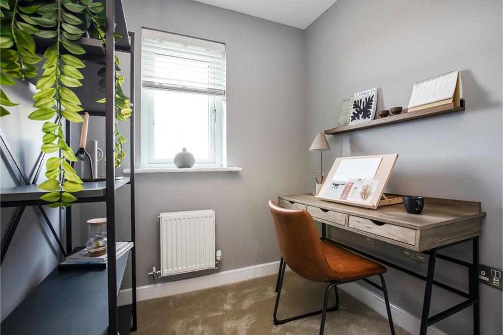 A compact and functional study room with a...