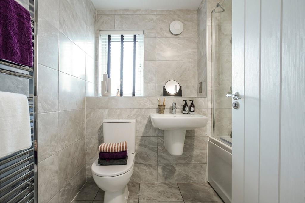 A well-appointed family bathroom that serves...