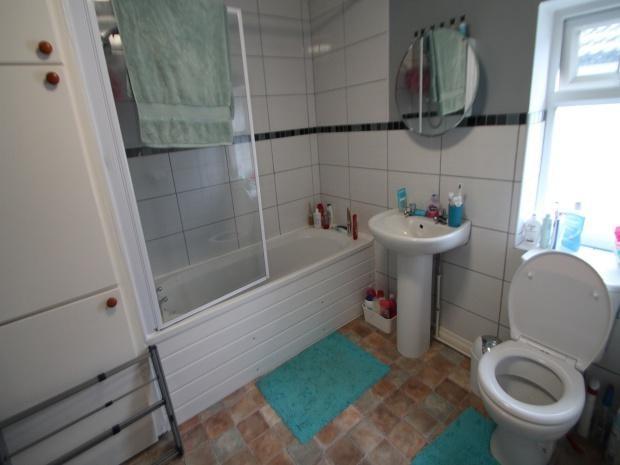 A clean, well-maintained bathroom featuring a b...