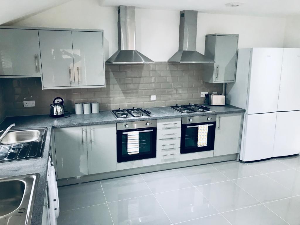 Modern and clean kitchen with ample counter spa...
