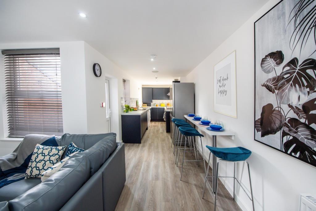 A modern and inviting living room with ample sp...