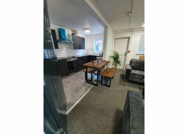 A comfortably furnished spacious living room fe...