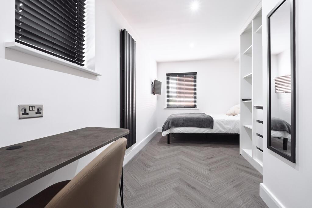 A modern, well-lit living area featuring contem...