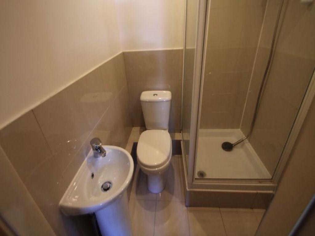 A clean and modern bathroom featuring a toilet,...