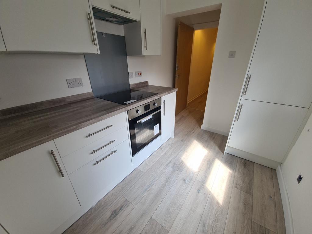 Bright and modern kitchen with ample natural li...