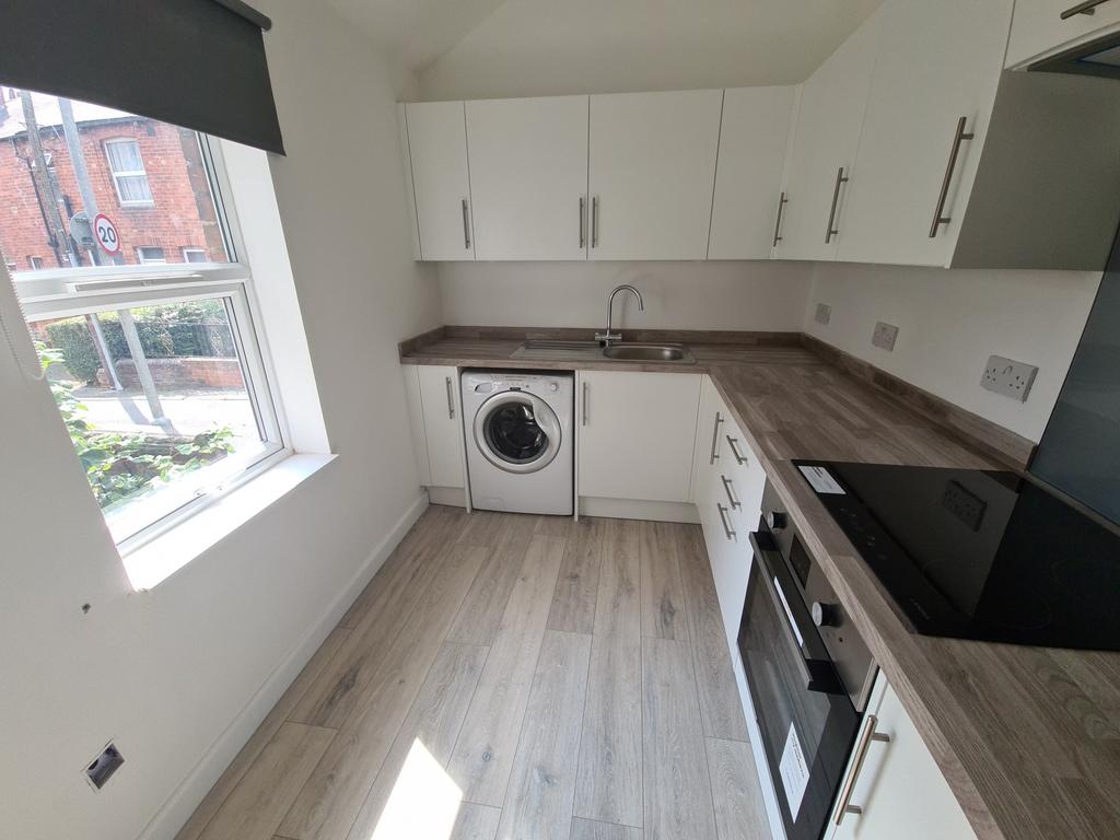 A bright and modern kitchen with ample workspac...