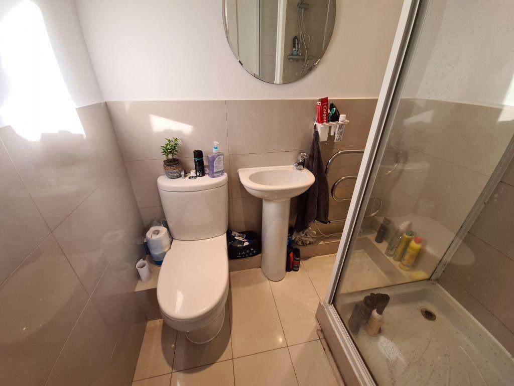 A clean and well-maintained bathroom with a toi...