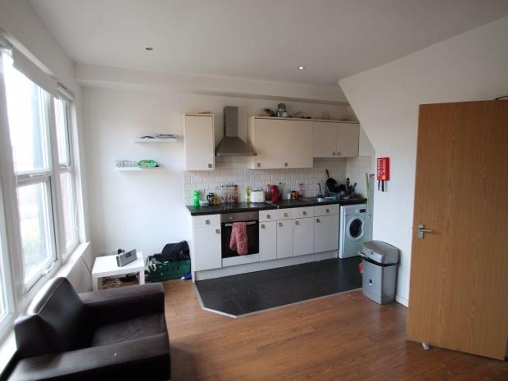 Bright and functional kitchen with ample natura...