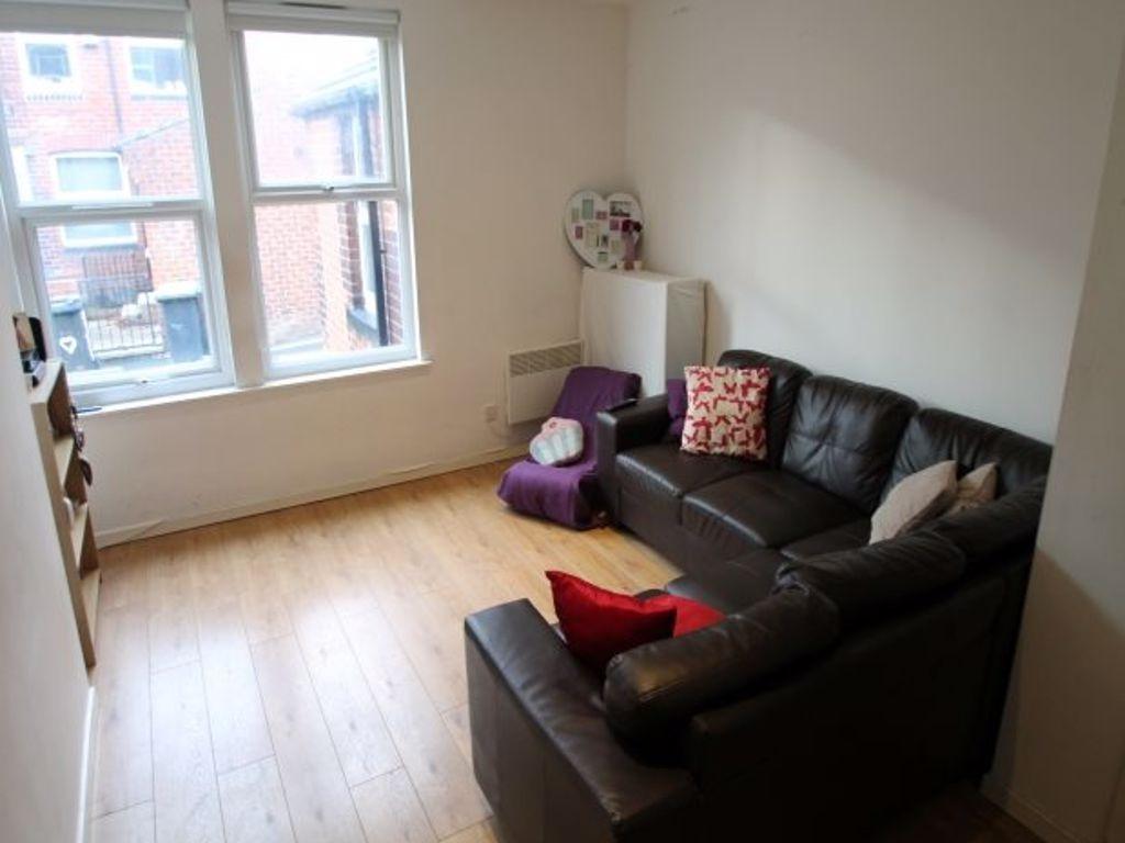 A cozy, well-maintained living room featuring a...