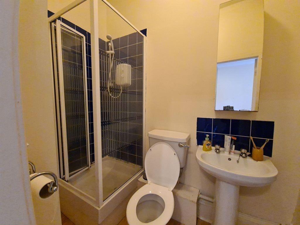 Bright and clean bathroom featuring a walk-in s...