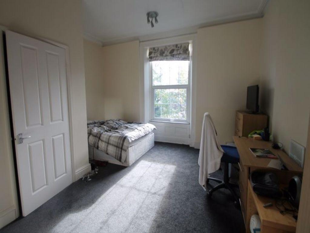 Bright and tidy room with a large window allowi...