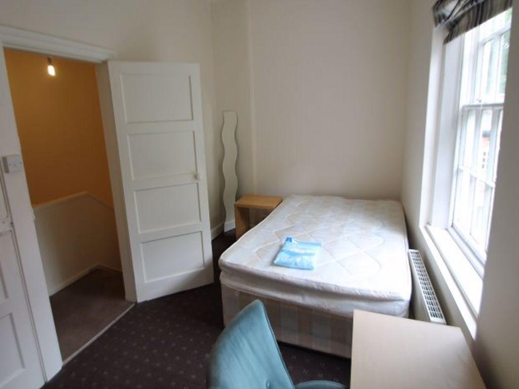 Cozy single bedroom featuring a comfortable sin...