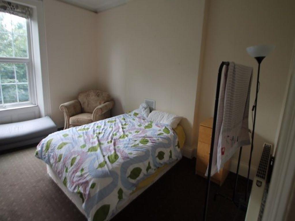 A cozy double bedroom featuring a comfortable d...