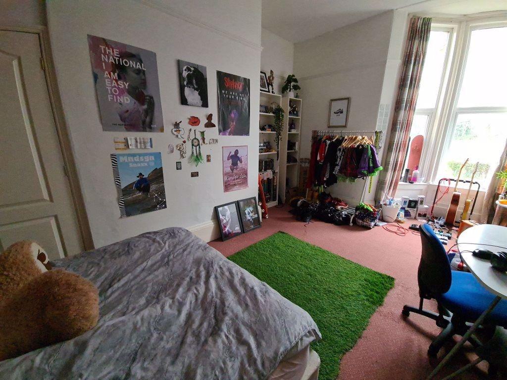 A bright and welcoming living room featuring a ...