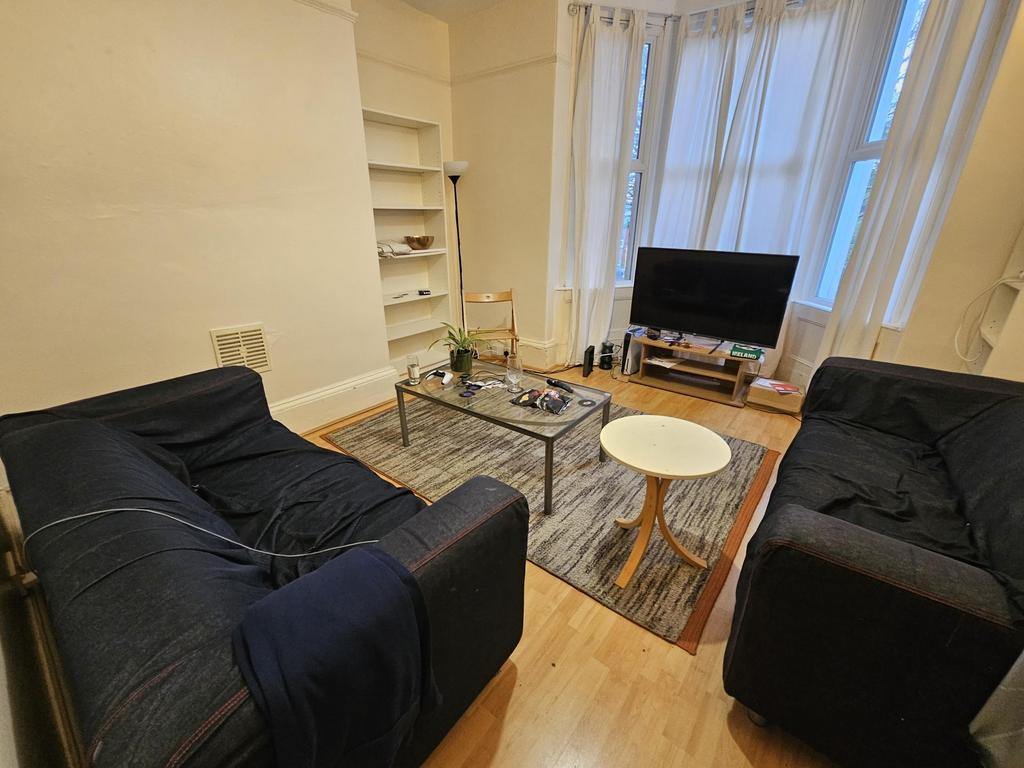 Bright, welcoming living room with two comforta...