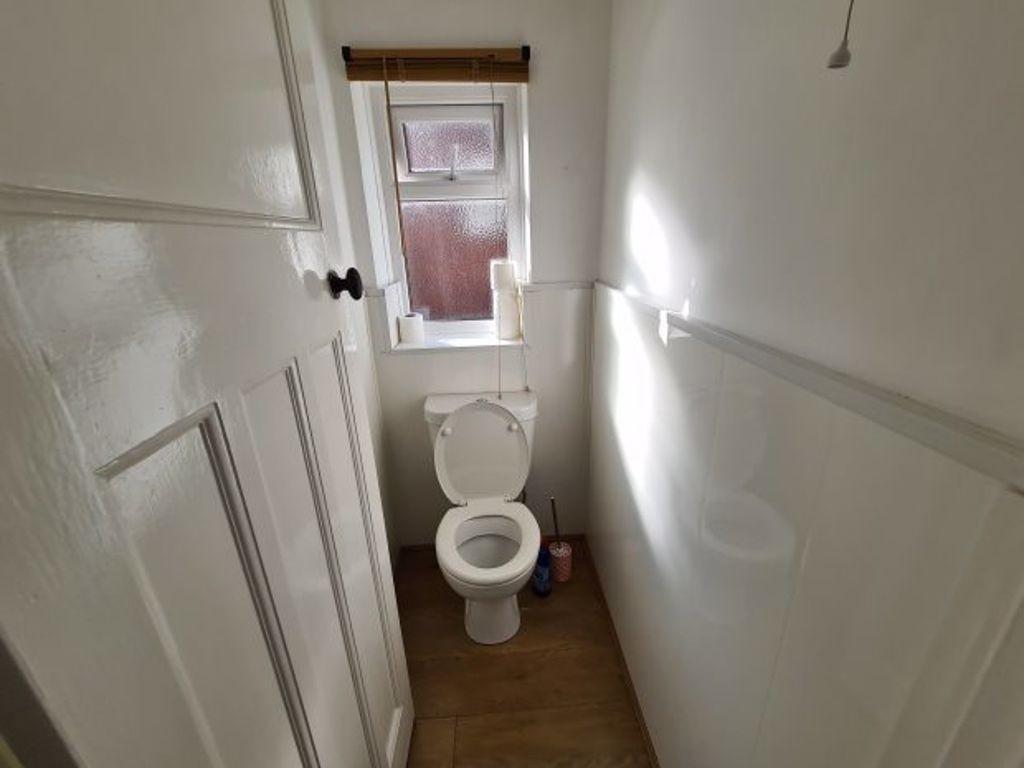 A well-maintained bathroom with a toilet and na...