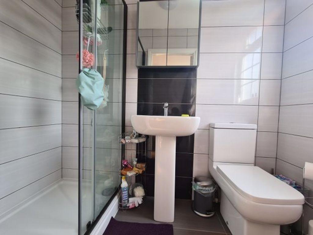 A clean, well-maintained bathroom featuring a s...