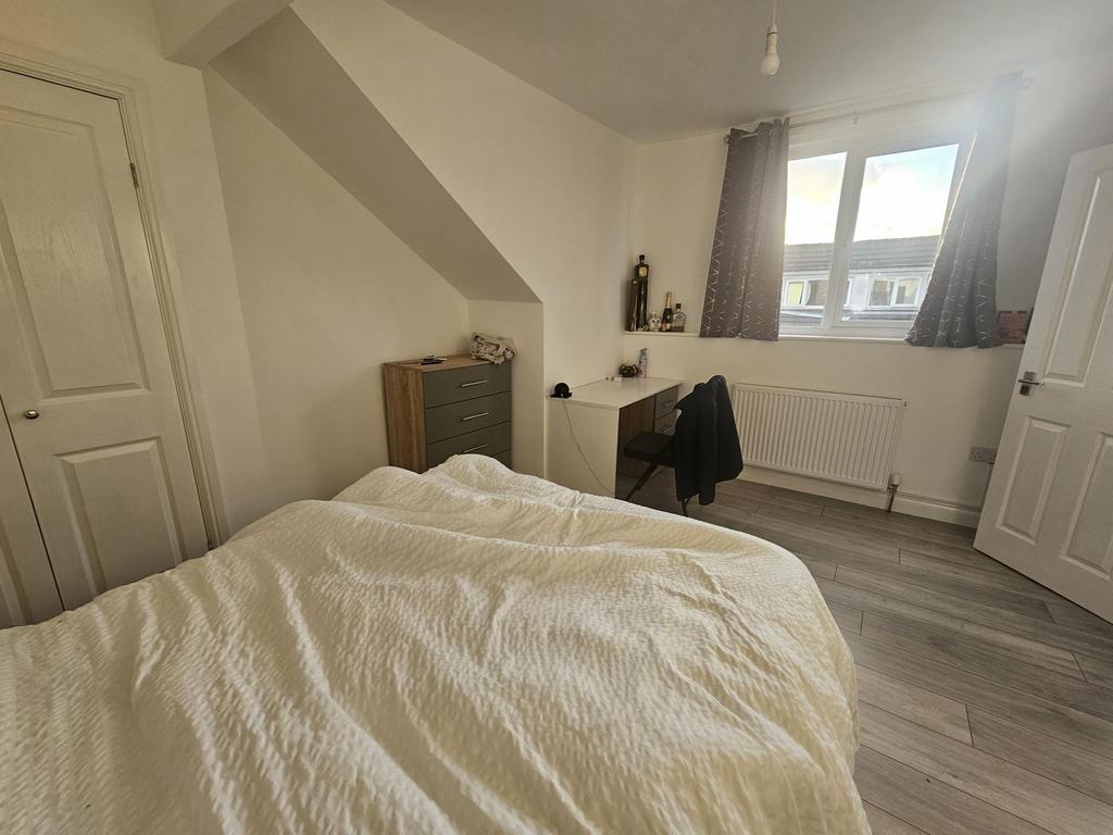 Bright and inviting master bedroom featuring a ...