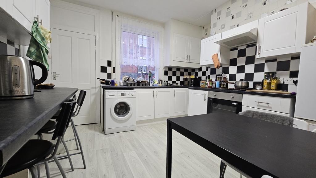 Modern and bright kitchen with ample work surfa...