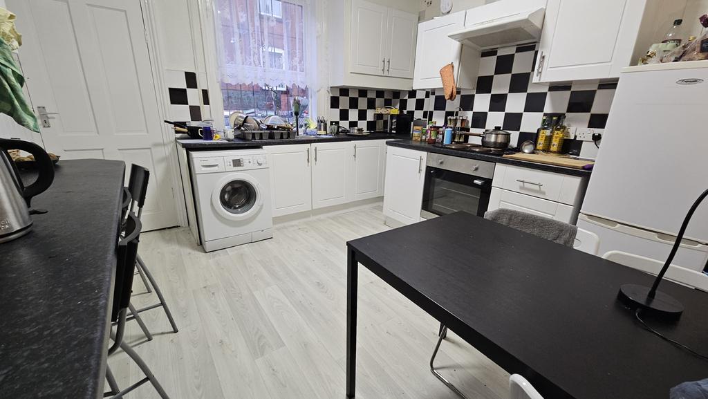 Bright and functional kitchen with ample worksp...