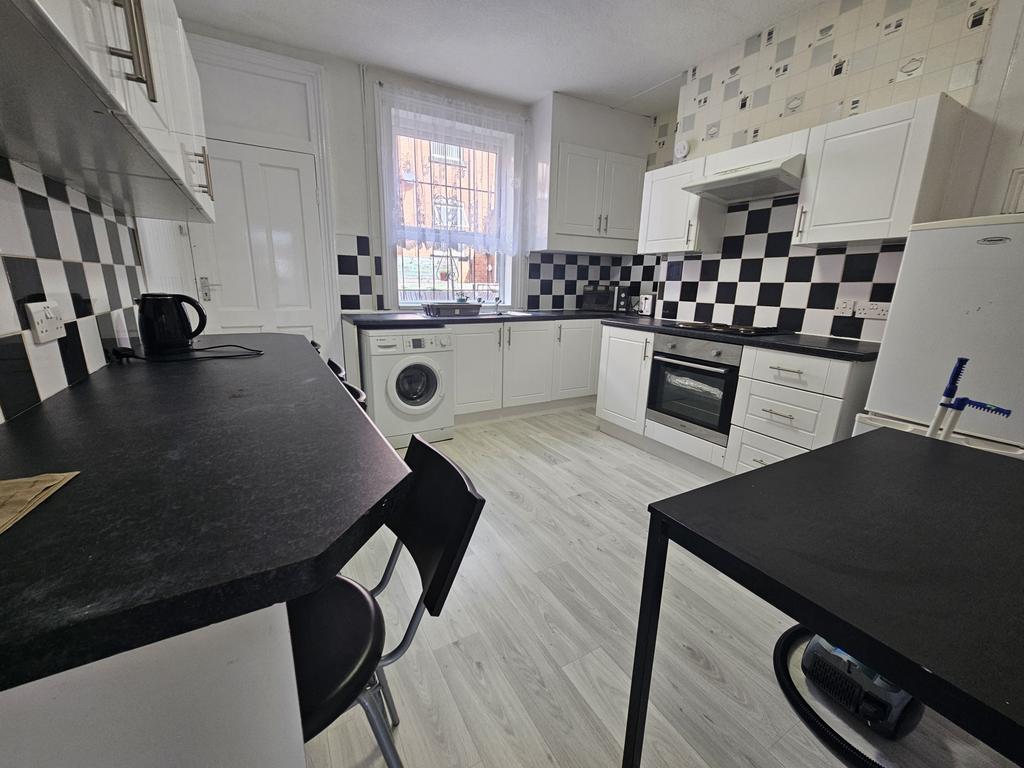 Bright and modern kitchen with ample natural li...