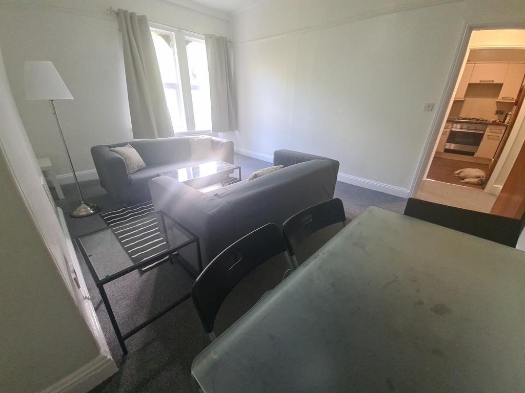 Bright and welcoming living room featuring comf...