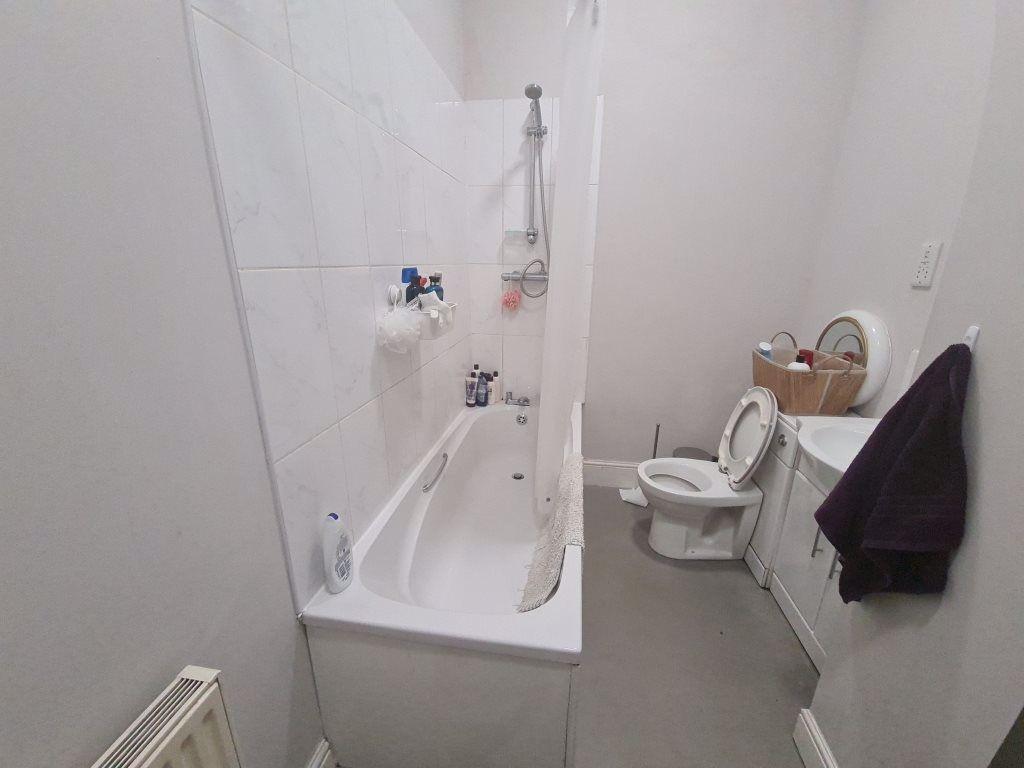 A clean and well-maintained bathroom featuring ...