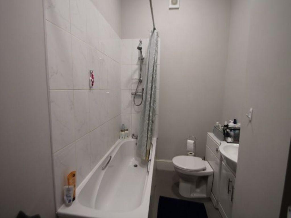 A clean and well-maintained bathroom with a bat...