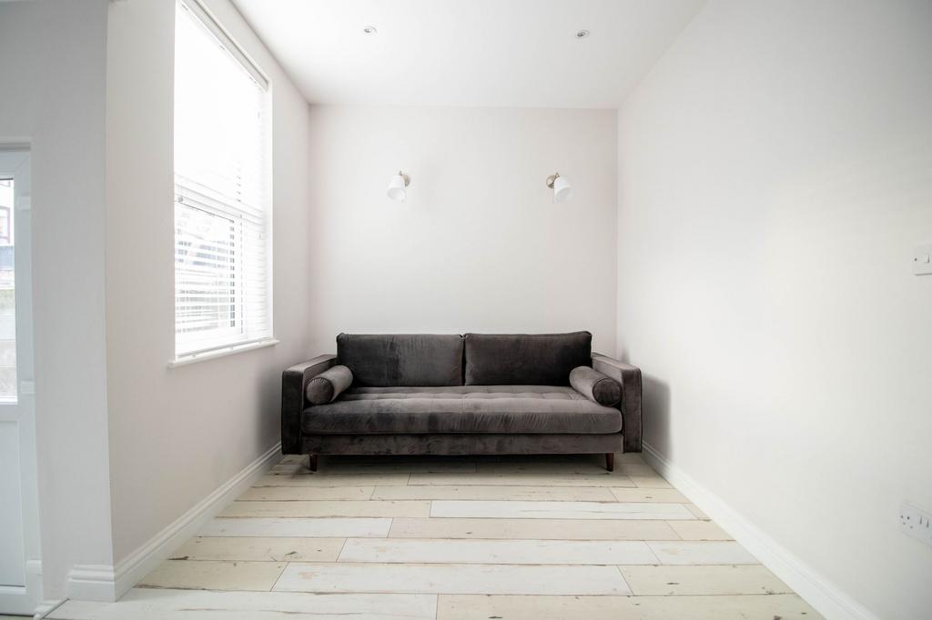 A bright and airy living room featuring a moder...
