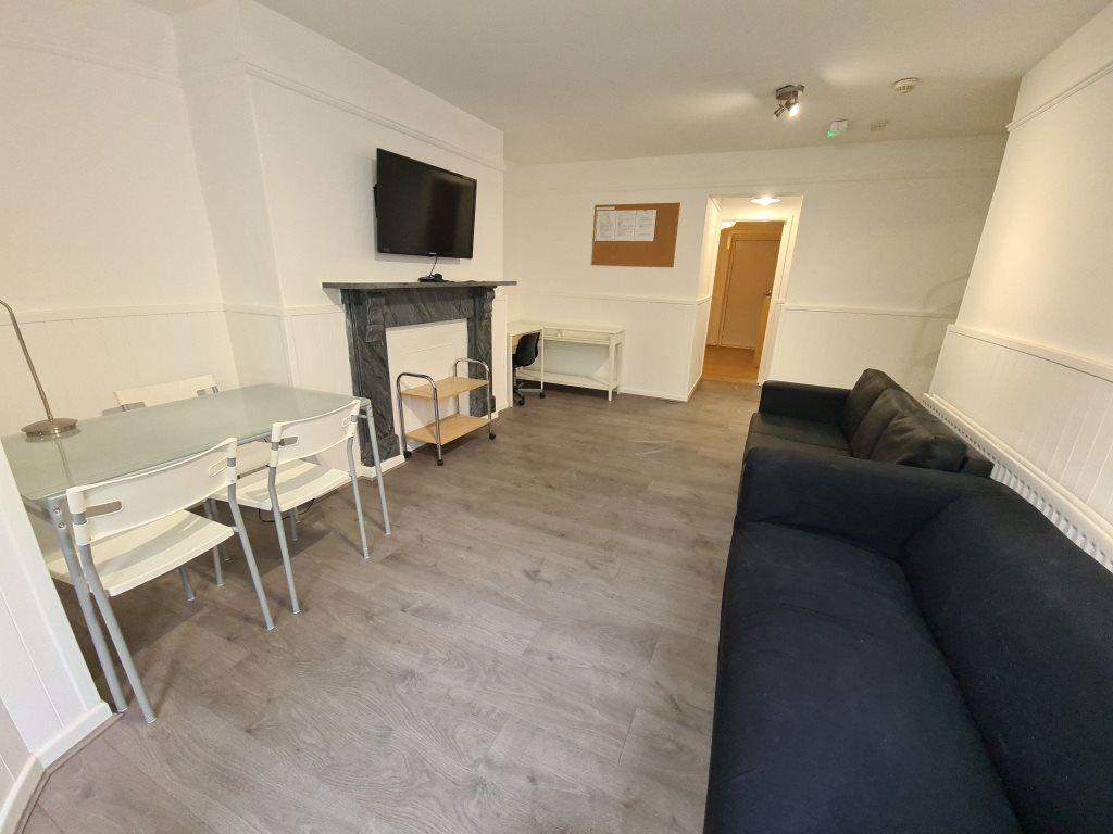 A spacious and well-maintained living room feat...