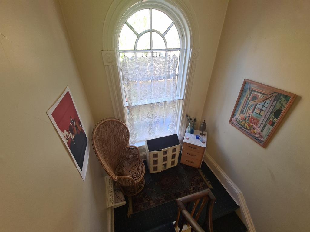 A well-lit bathroom with a window allowing natu...