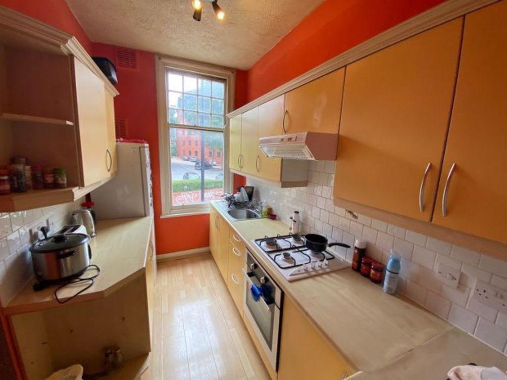 Bright and well-maintained kitchen with ample s...