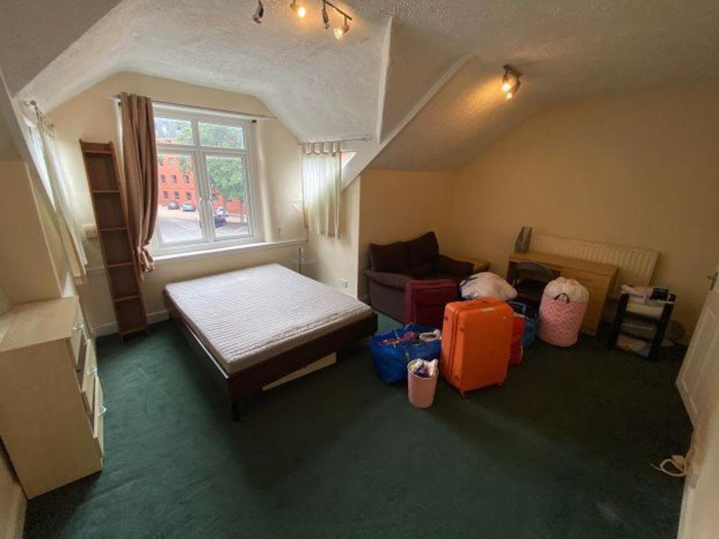 A cozy and well-maintained living room with a c...