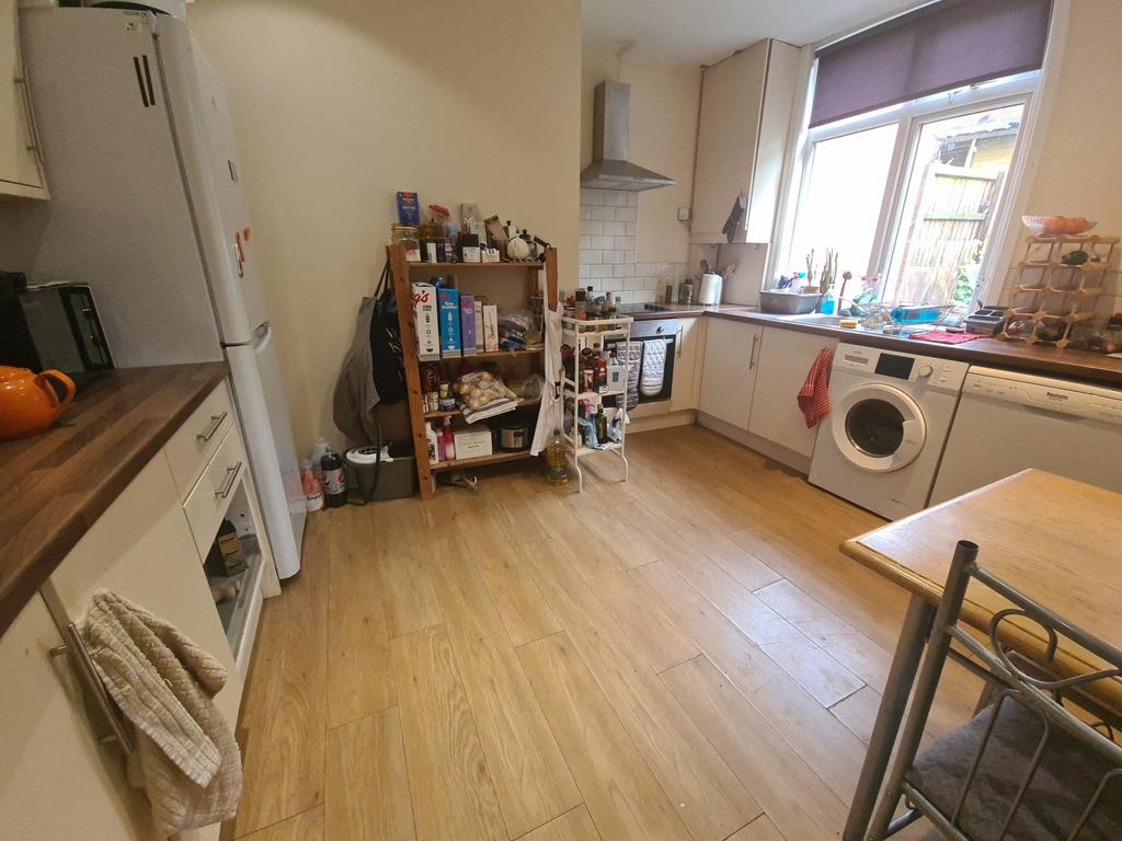 Bright and modern kitchen featuring ample count...