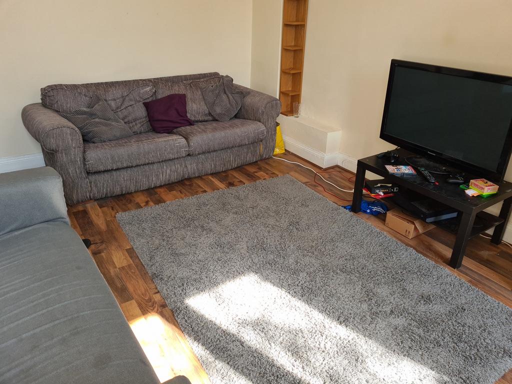 A welcoming living room featuring a comfortable...